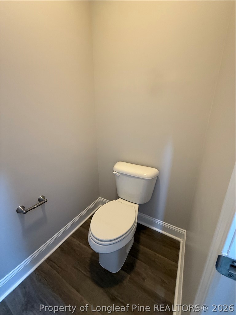 663 Hector McNeill Road Raeford, NC 28376 - Photo 10 of 16 a white toilet sitting next to a white wall