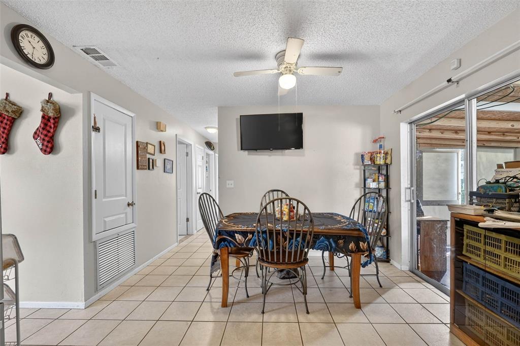 2613 Fowler Avenue Auburndale, FL 33823 - Photo 21 of 61 a view of a a dining room with furniture and a window