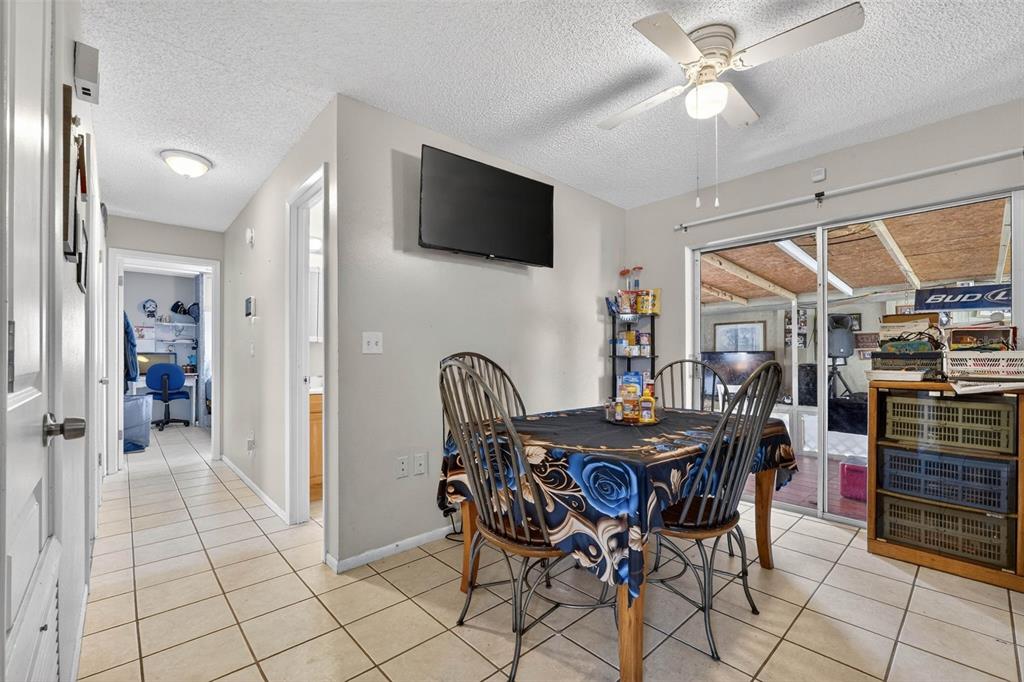 2613 Fowler Avenue Auburndale, FL 33823 - Photo 22 of 61 a dining room with furniture and window