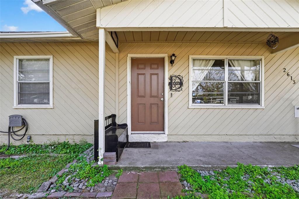 2613 Fowler Avenue Auburndale, FL 33823 - Photo 26 of 61 a front view of a house with a yard