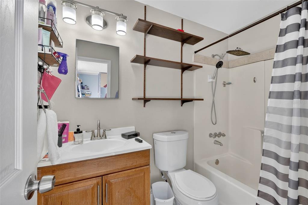 2613 Fowler Avenue Auburndale, FL 33823 - Photo 27 of 61 a white toilet sitting next to a bathroom sink