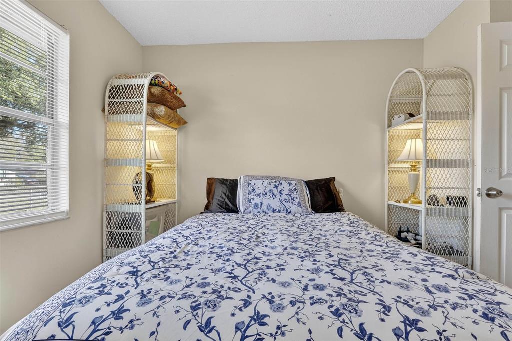 2613 Fowler Avenue Auburndale, FL 33823 - Photo 30 of 61 a bedroom with a bed and a window