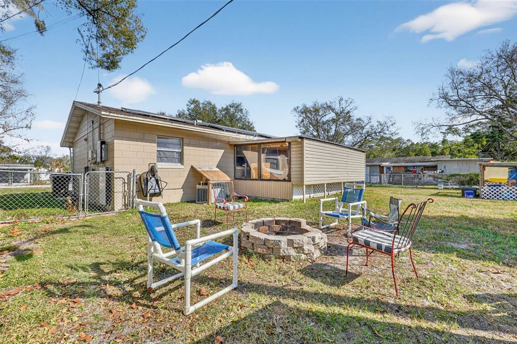 2613 Fowler Avenue Auburndale, FL 33823 - Photo 42 of 61 a view of a patio with table and chairs and potted plants