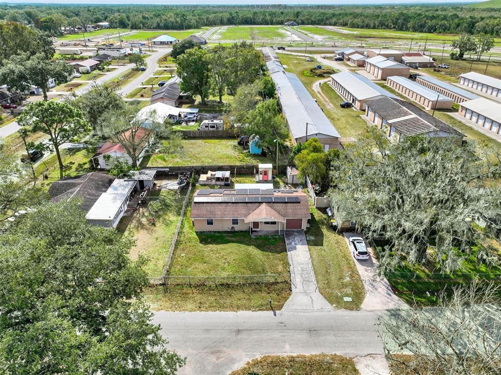 2613 Fowler Avenue Auburndale, FL 33823 - Photo 52 of 61 an aerial view of residential houses with outdoor space and swimming pool