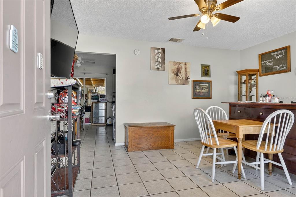 2613 Fowler Avenue Auburndale, FL 33823 - Photo 10 of 61 a view of a livingroom with furniture and a flat screen tv