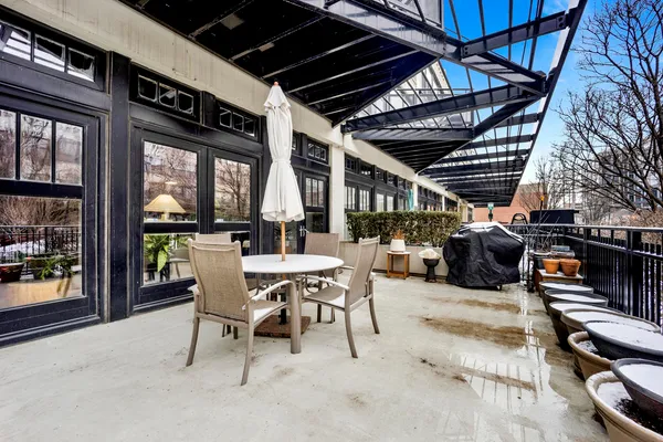 a view of a chairs and table in a patio