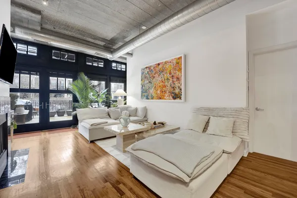 a bedroom with a large bed and a large window