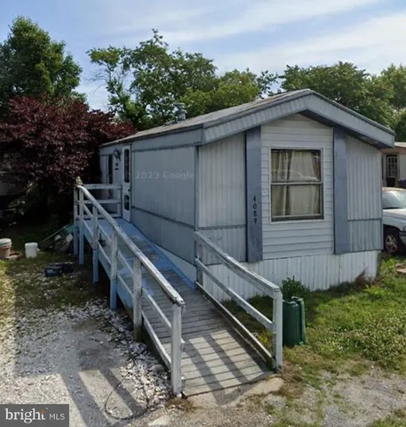 a house with trees in the background