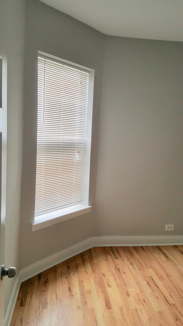 5708 South Aberdeen Street Chicago, IL 60621 - Photo 11 of 25 a view of an empty room with a window