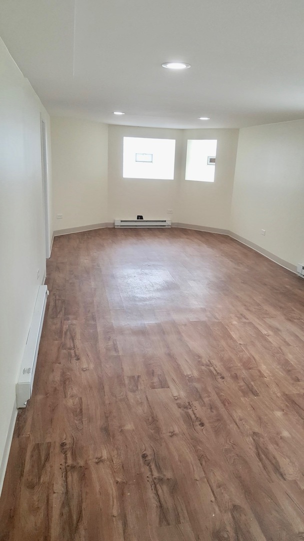 5708 South Aberdeen Street Chicago, IL 60621 - Photo 13 of 25 an empty room with a window