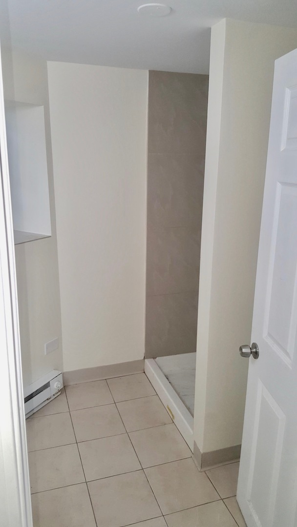 5708 South Aberdeen Street Chicago, IL 60621 - Photo 14 of 25 a view of an empty walk in closet