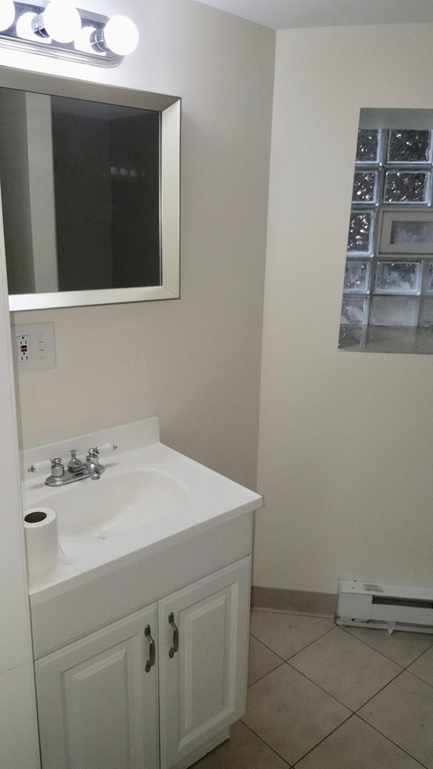 5708 South Aberdeen Street Chicago, IL 60621 - Photo 15 of 25 a utility room with a sink and cabinets