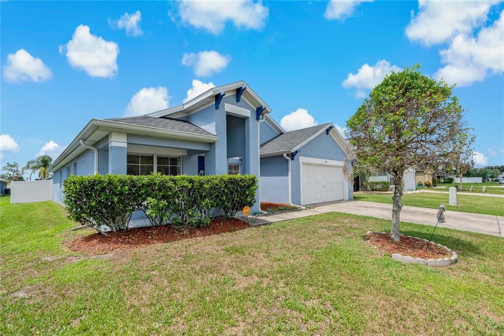 2576 Boots Road Lakeland, FL 33810 - Photo 1 of 1 a front view of a house with a yard