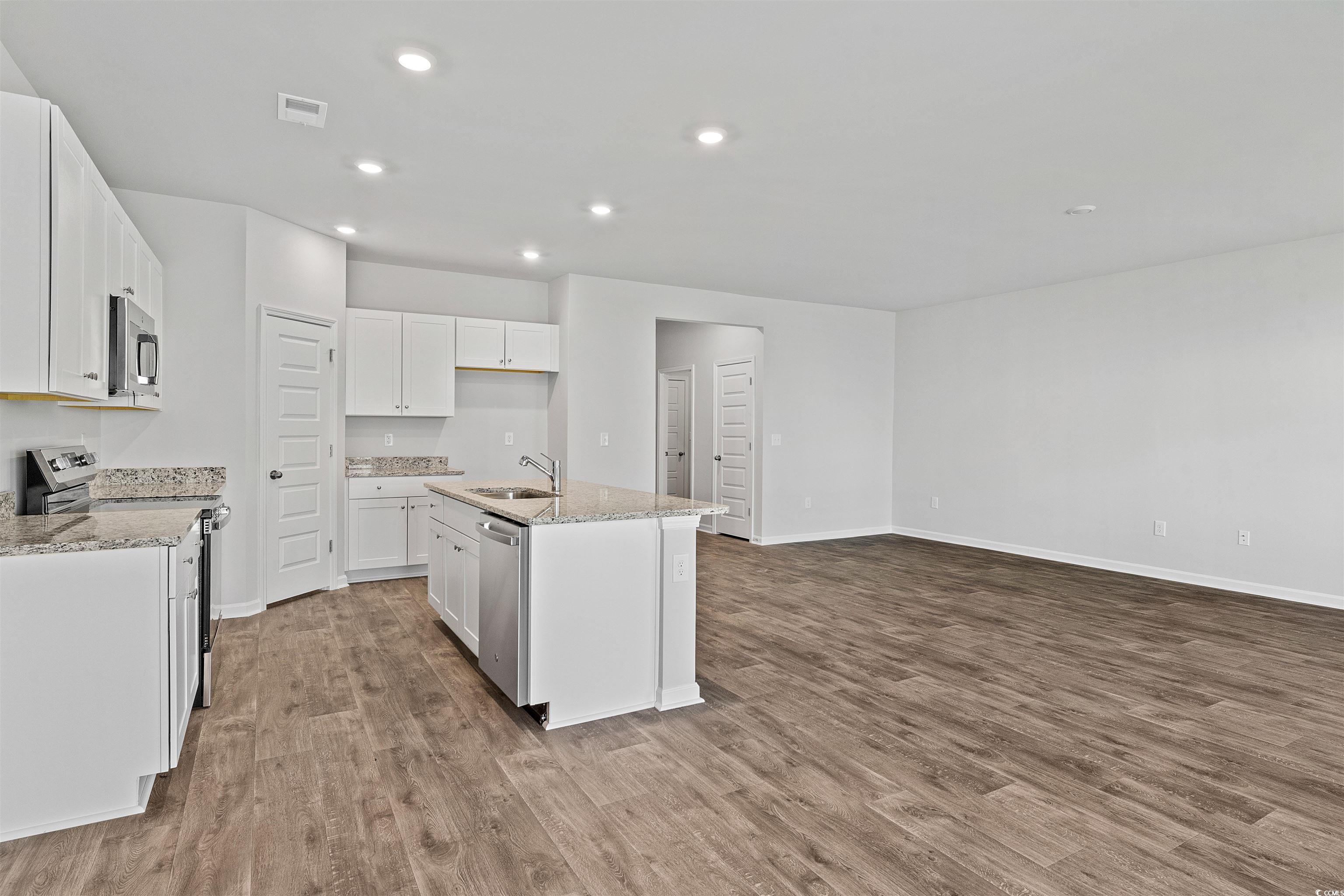 419 Ribbon Rail Way Loris, SC 29569 - Photo 17 of 32 Kitchen featuring a center island with sink, light