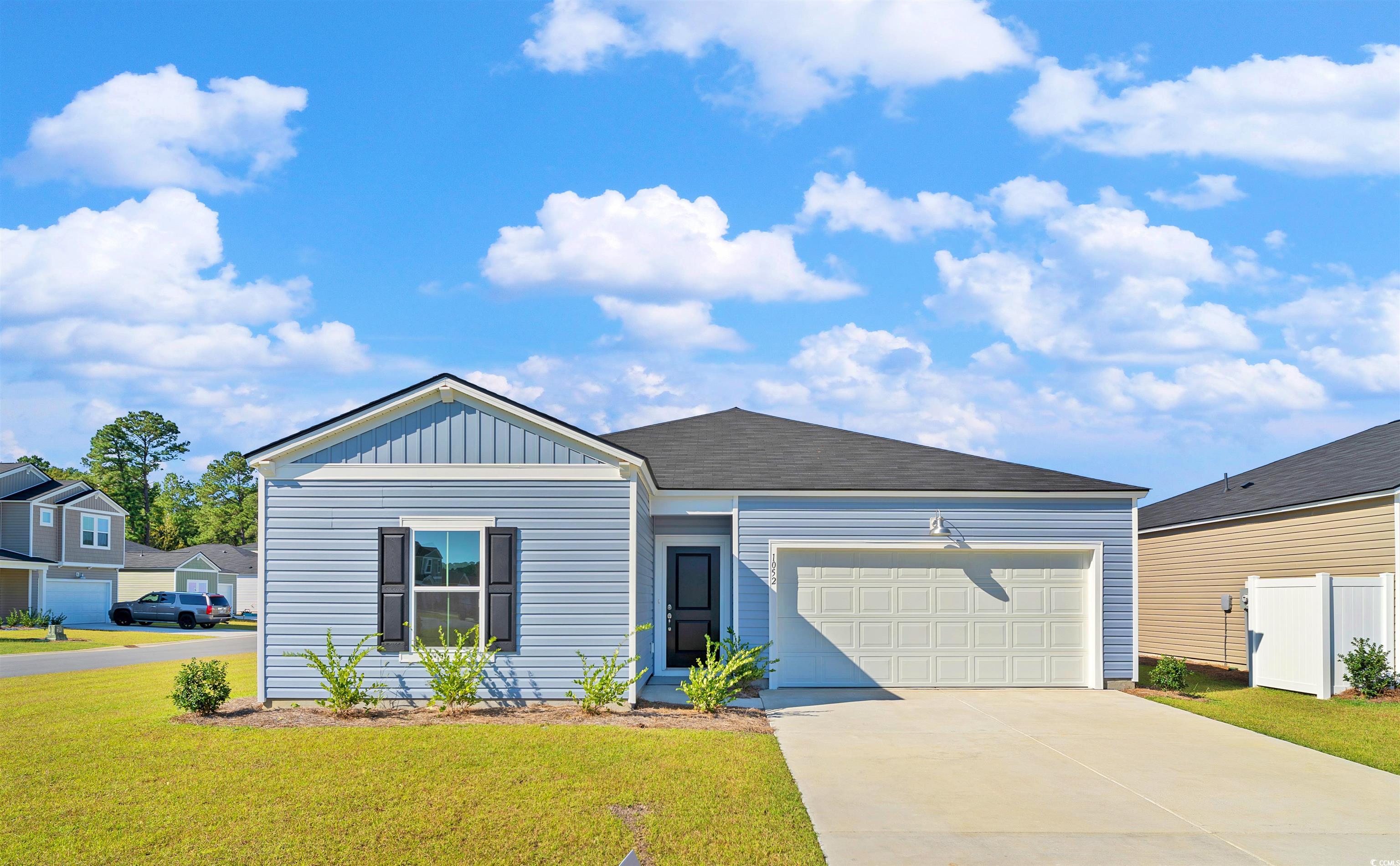 419 Ribbon Rail Way Loris, SC 29569 - Photo 22 of 32 View of front of home featuring a garage and a fro
