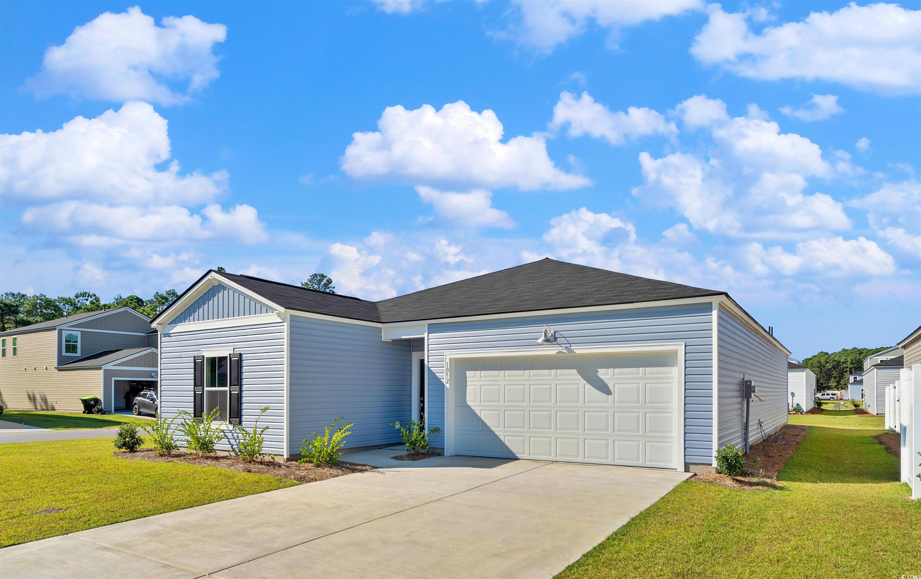 419 Ribbon Rail Way Loris, SC 29569 - Photo 3 of 32 View of front facade with a garage and a front law
