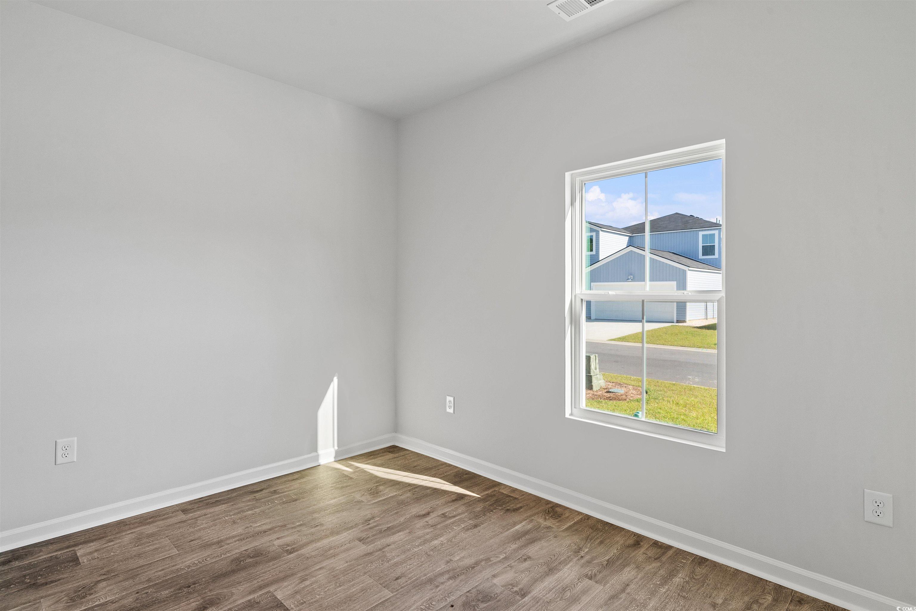 419 Ribbon Rail Way Loris, SC 29569 - Photo 5 of 32 Spare room featuring hardwood / wood-style floors