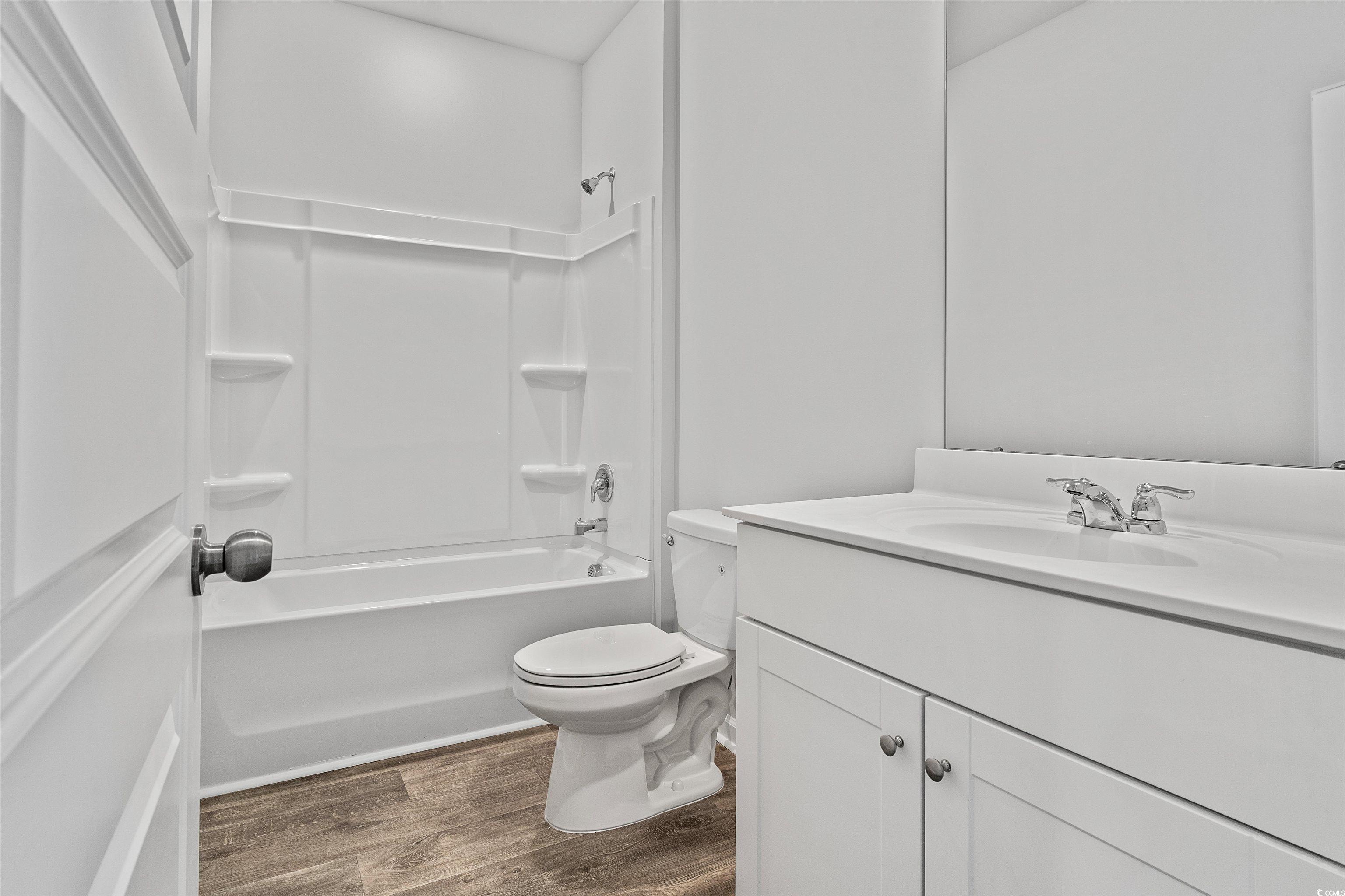 419 Ribbon Rail Way Loris, SC 29569 - Photo 7 of 32 Full bathroom featuring hardwood / wood-style floo