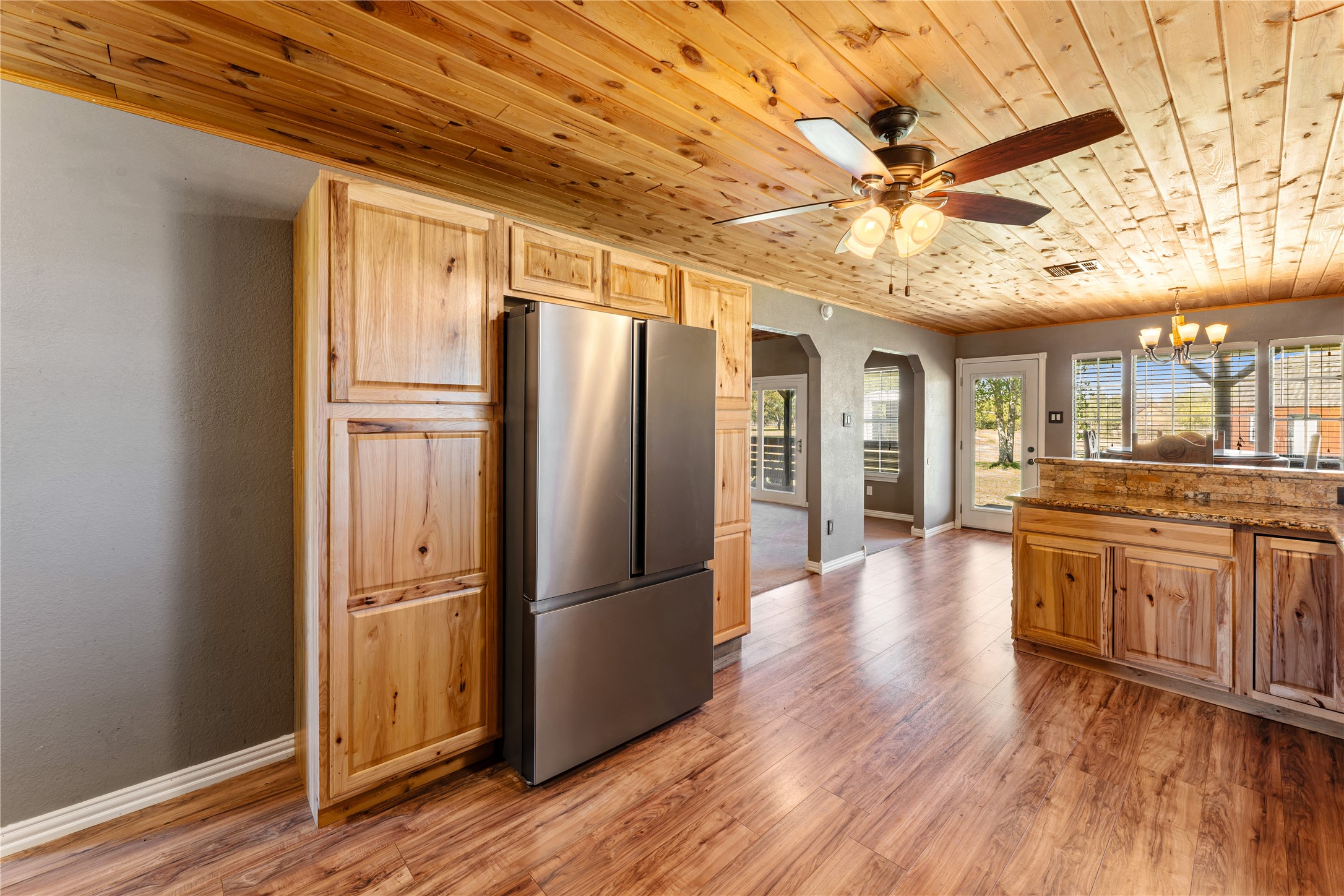 36610 Lariat Lane Simonton, TX 77485 - Photo 16 of 43 a view of a kitchen with a refrigerator and wooden floor