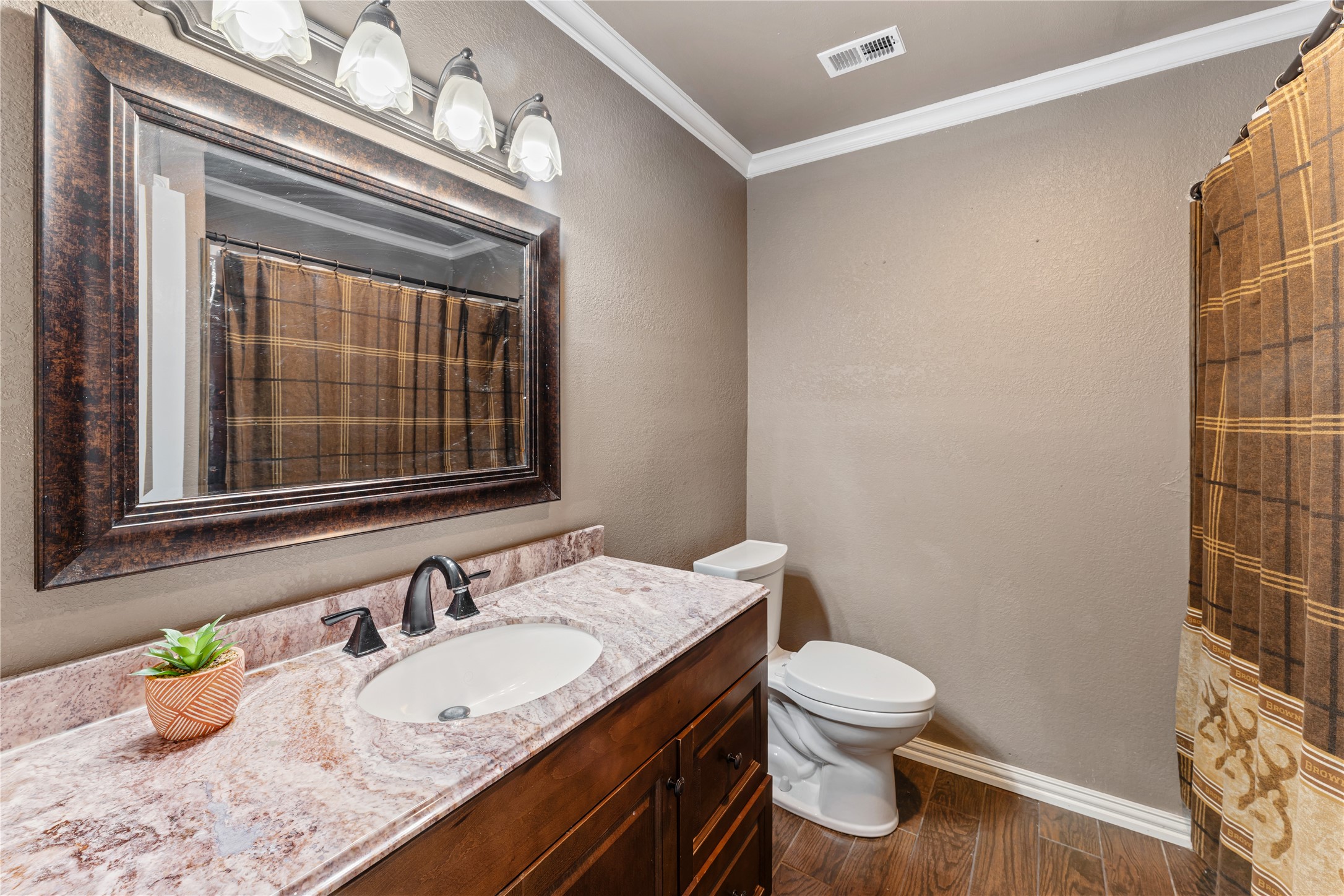 36610 Lariat Lane Simonton, TX 77485 - Photo 28 of 43 a bathroom with a granite countertop sink a toilet and a mirror