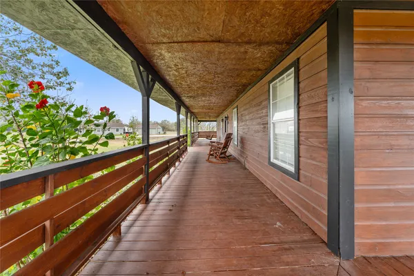 a view of a house with a garden and yard