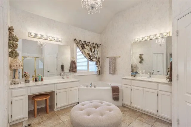 a bathroom with a sink mirror and a toilet