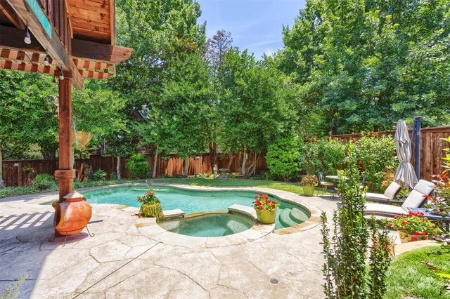 a view of a swimming pool with a patio