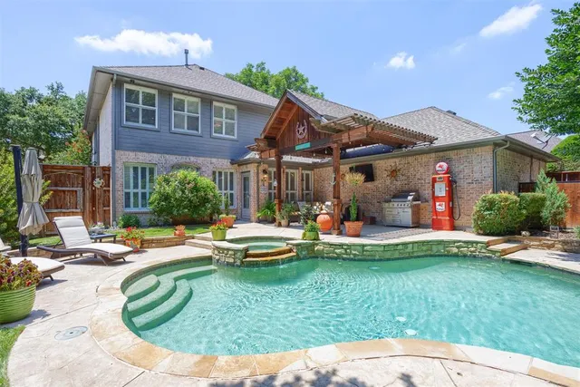 a view of a house with pool and chairs