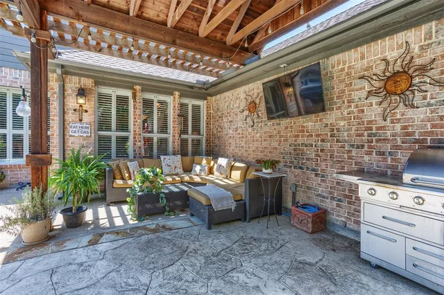 a view of a patio with couches and potted plants