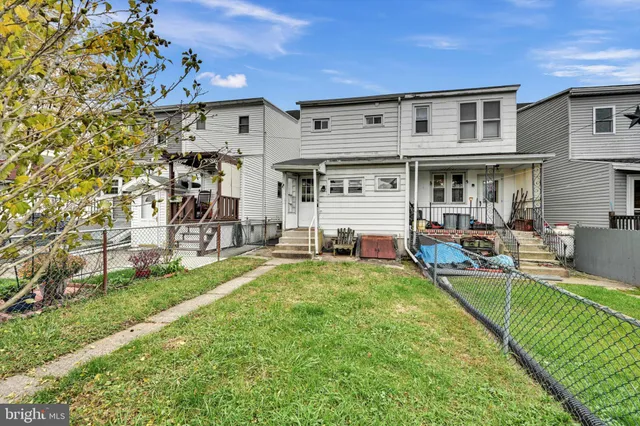 a view of a chairs and table in the patio