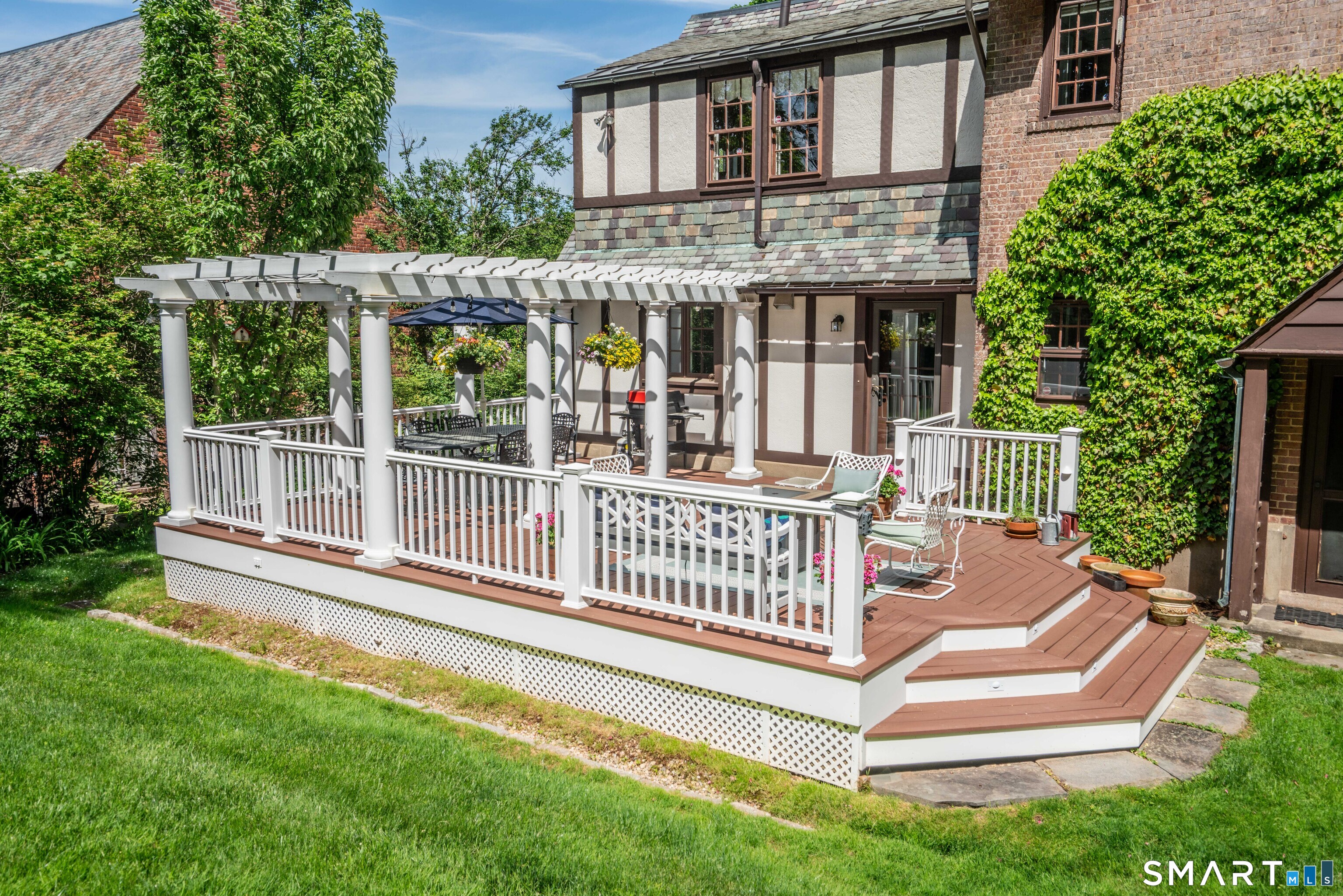 7 Fernwood Road West Hartford, CT 06119 - Photo 35 of 40 a view of a house with a yard and deck