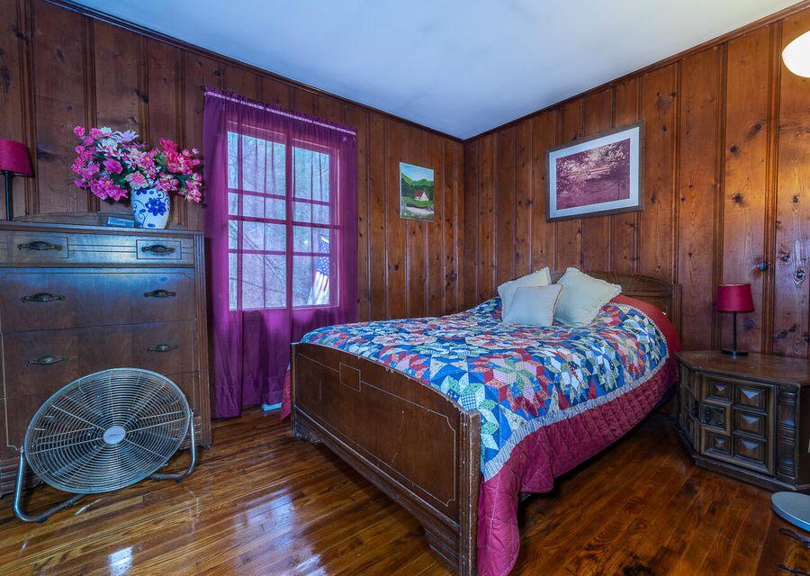 8122 Rich Patch Road Covington, VA 24426 - Photo 12 of 36 a bedroom with a bed and a painting on the wall