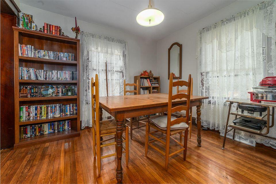 8122 Rich Patch Road Covington, VA 24426 - Photo 16 of 36 a dining room with furniture and a book shelf