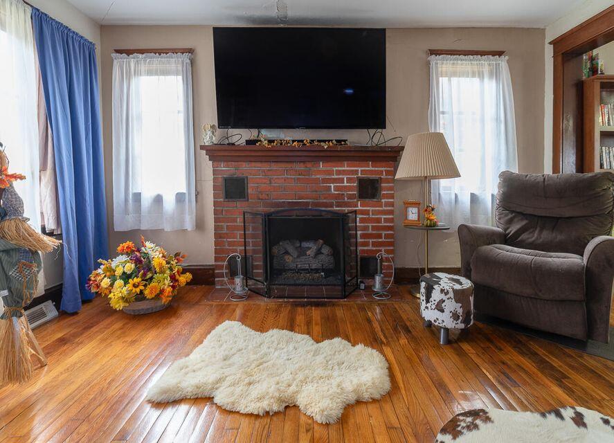 8122 Rich Patch Road Covington, VA 24426 - Photo 23 of 36 a living room with furniture fireplace and flat screen tv