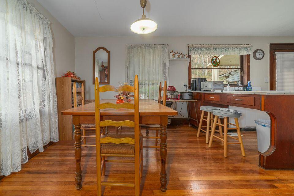 8122 Rich Patch Road Covington, VA 24426 - Photo 30 of 36 a view of a dining room with furniture and wooden floor
