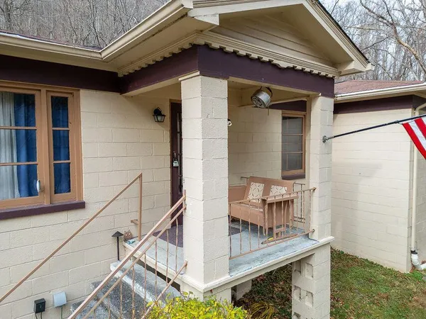 a view of balcony with furniture and rug