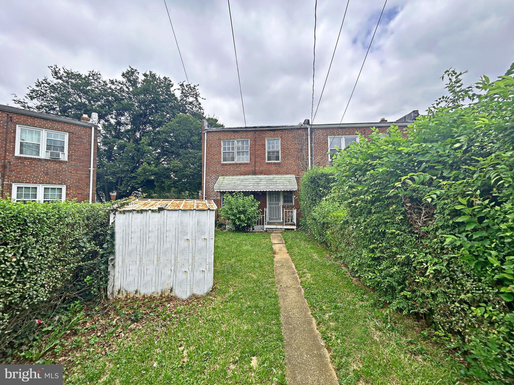4211 Colborne Road Baltimore, MD 21229 - Photo 3 of 18 a view of a house with a yard and plants
