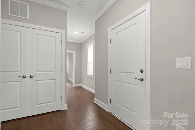 an empty room with wooden floor