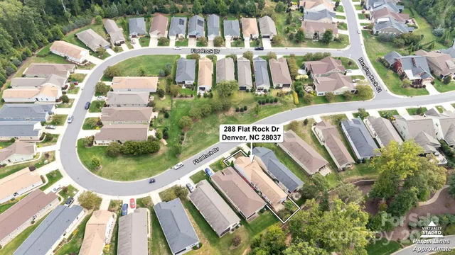 a view of swimming pool with a patio and plants