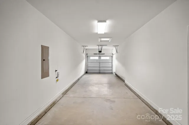 a view of a kitchen with wooden floor and a sink