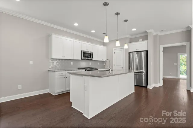 a large kitchen with cabinets