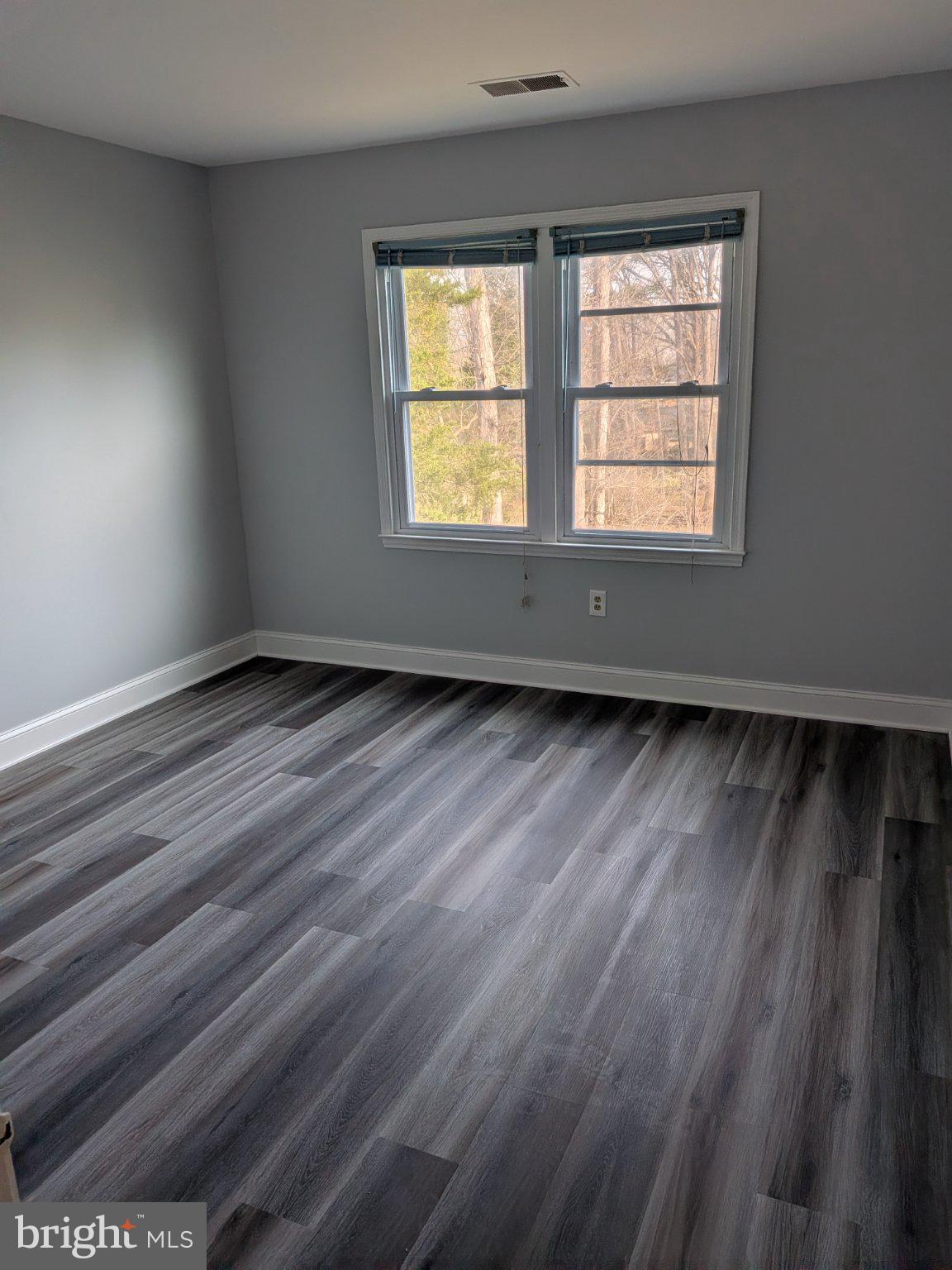 1516 Coat Ridge Road Herndon, VA 20170 - Photo 9 of 20 Bright and airy room with nature views.