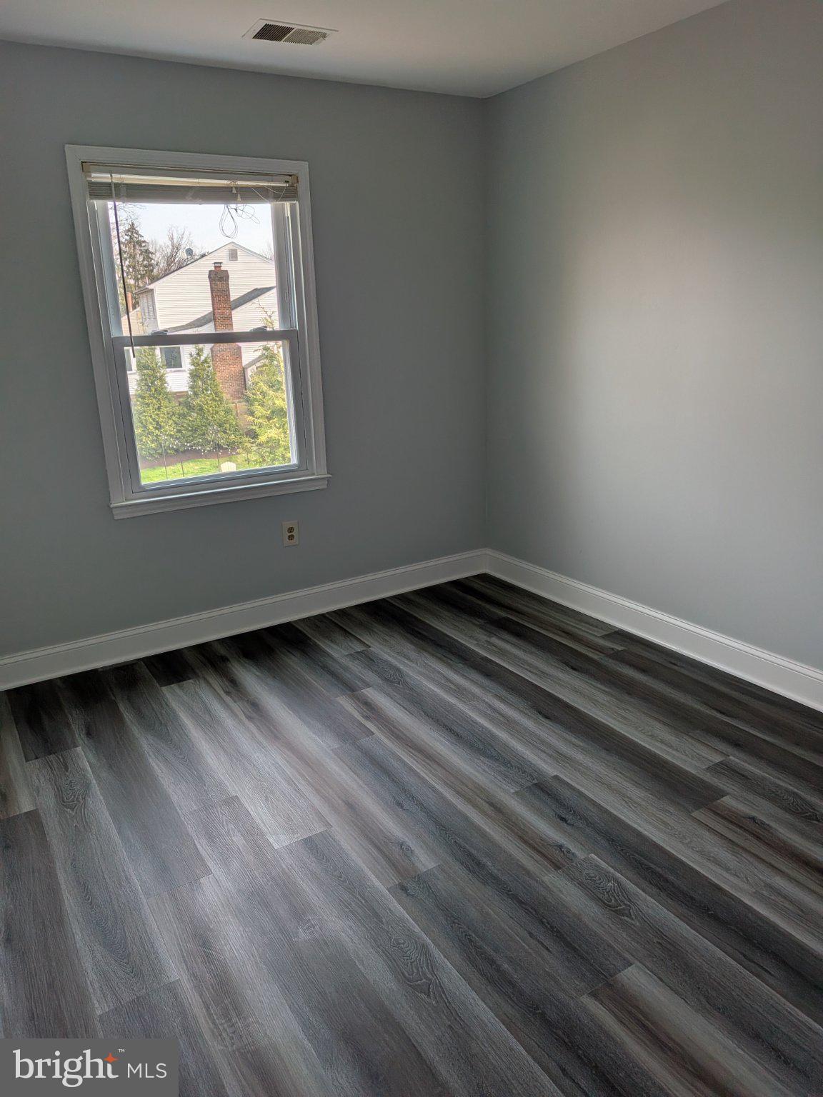1516 Coat Ridge Road Herndon, VA 20170 - Photo 10 of 20 Bright and airy room with modern flooring.
