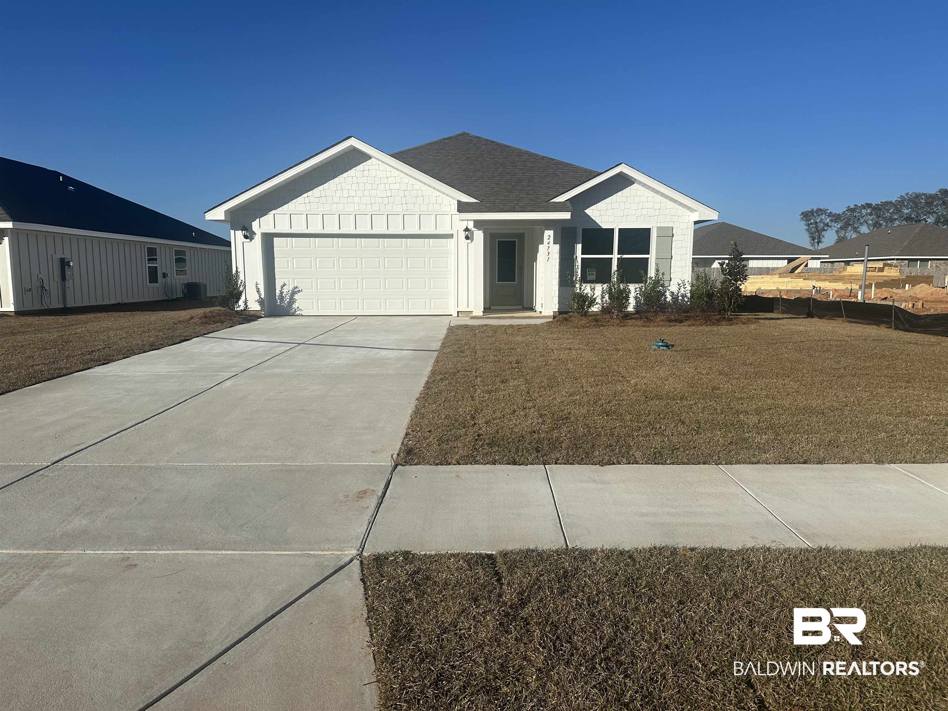 24731 Ponder Loop Loxley, AL 36551 - Photo 1 of 24 View of front of property featuring a garage and a front yard