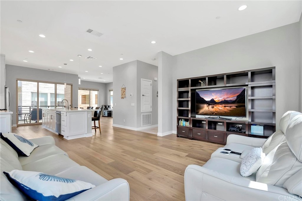 57 Ebb Tide Circle Newport Beach, CA 92663 - Photo 3 of 12 a living room with furniture and a flat screen tv