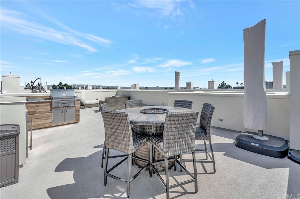 57 Ebb Tide Circle Newport Beach, CA 92663 - Photo 10 of 12 a view of a terrace with furniture and stove