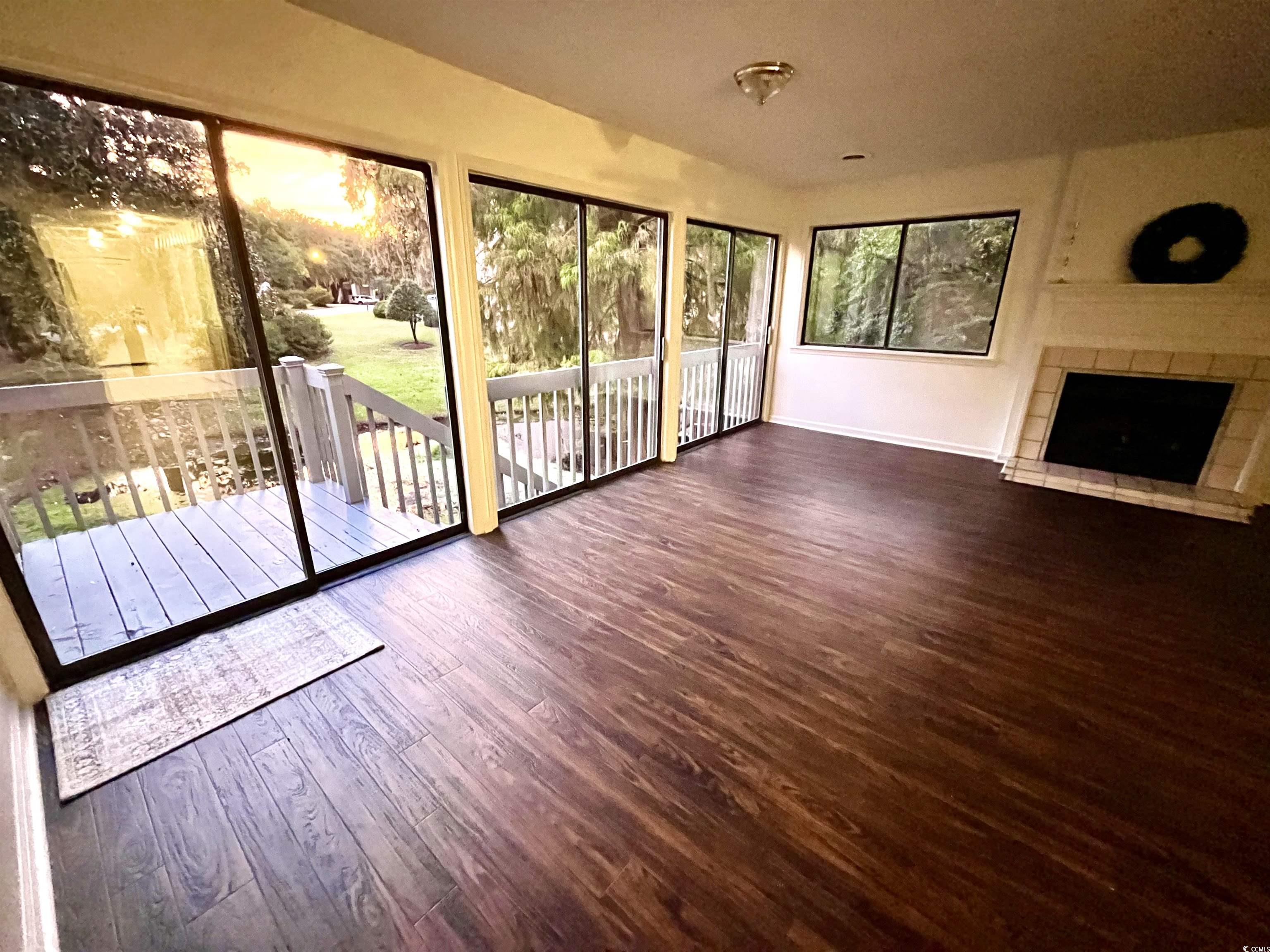 31 Battery White Court, Unit 1005 Georgetown, SC 29440 - Photo 5 of 34 View of unfurnished sunroom