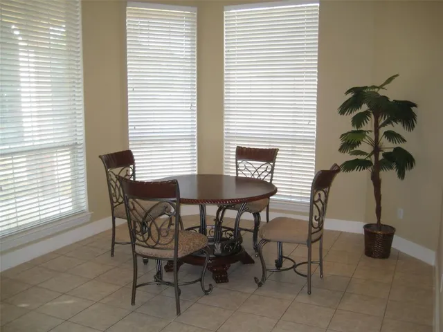 a view of a livingroom with furniture and a potted plant