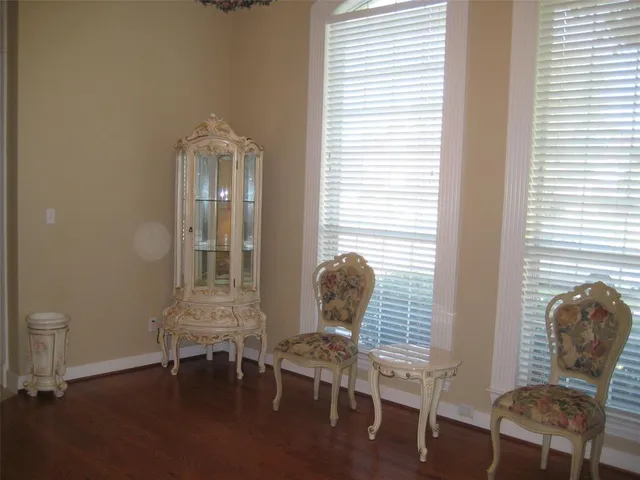 a view of a room with lounge chair and windows