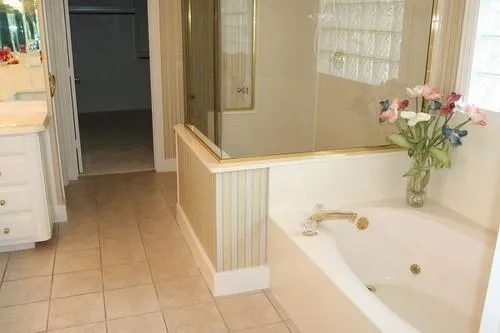 a bathroom with a bathtub and shower